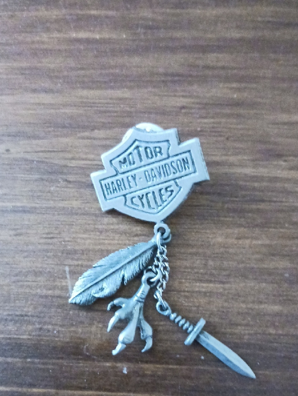 Harley-Davidson Silver Shield Pin with Feather, Claw & Sword Charms.
